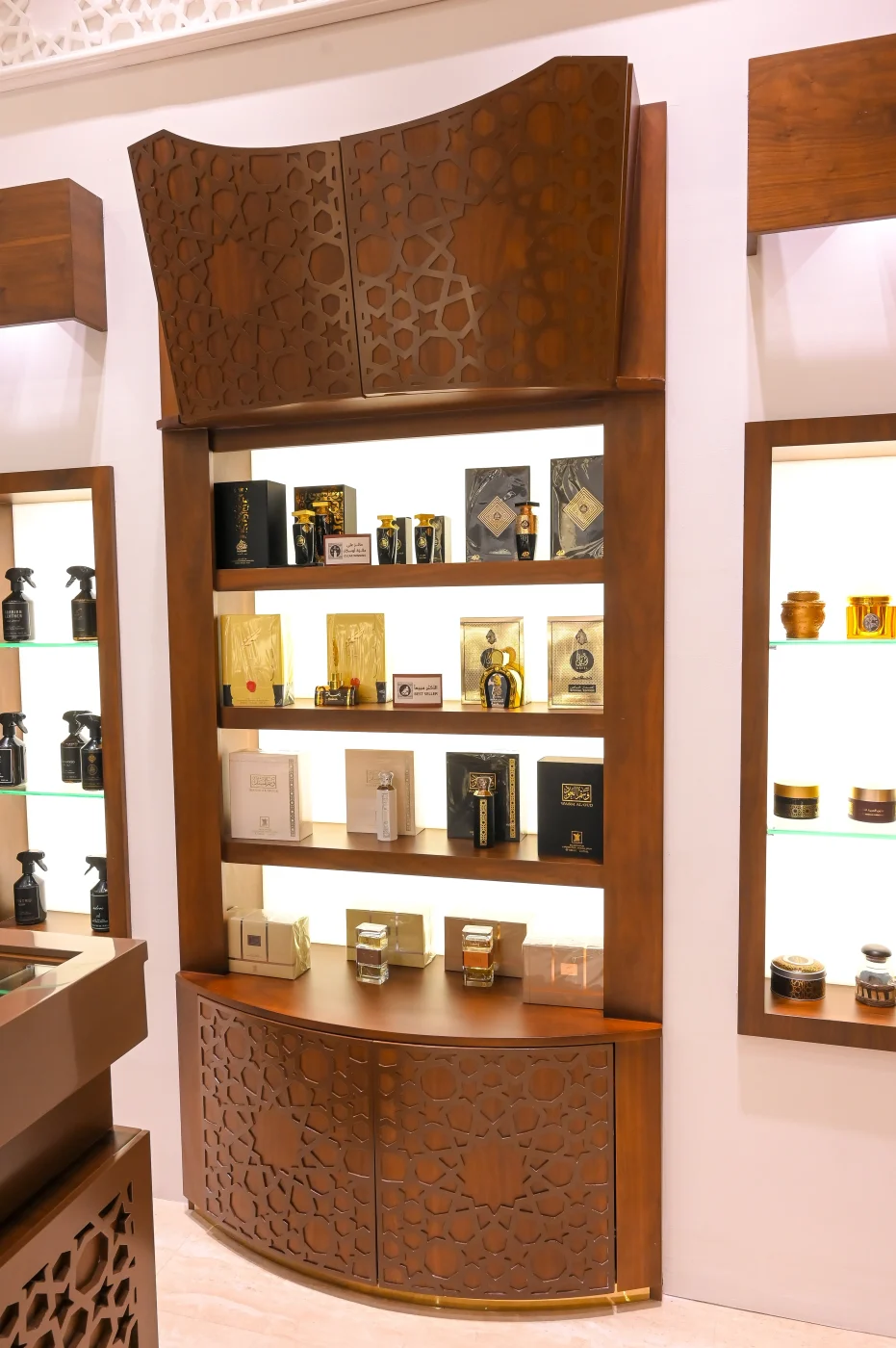 Arabian Oud boutique lighting design Dubai - UMI Group interior design showcasing strategic lighting solutions for luxury perfume retail, creating ambient atmosphere in premium UAE shopping destination